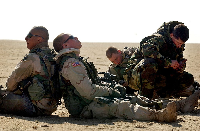 A squad of soldier rests in the dessert waiting orders for an attack during a training a exercise with the U.S. Army 3rd Division. Getty